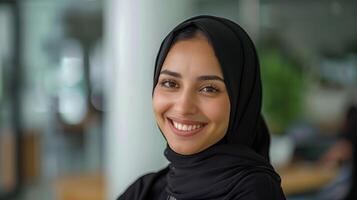 Portrait of a Smiling Saudi Woman in Hijab, Bright and Positive Expression photo