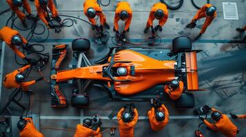 High-Angle View of Formula One Pit Crew Working on Race Car During a Pit Stop photo