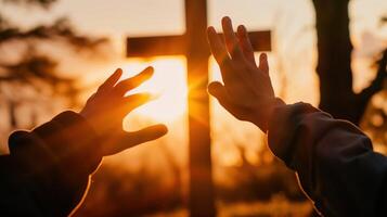Close-Up of Hands Reaching Out Towards the Sun at Sunset photo