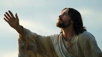Embracing Redemption Jesus Christ with Open Arms in Meditative Pose Looking Heavenward photo