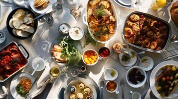 Delicious Brunch Spread with Various Dishes on a Sunlit Table photo