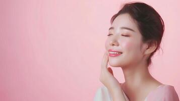 Smiling Woman Embracing Natural Beauty in a Soft Pink Background, Showcasing Radiant Skin and Serene Expression photo