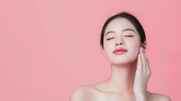 Beautiful Woman Enjoying Skincare Routine with Radiant Skin on Pink Background photo