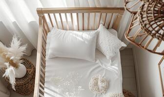 Top View of Cozy Baby Crib with White Bedding and Soft Decor for Serene Nursery Ambiance photo