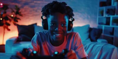 Excited Teenage Boy Playing Games at Home While Wearing Headphones and Smiling photo