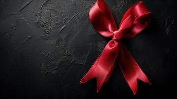 Elegant Red Ribbon Bow on Black Background for Black Friday Sale Shopping Promotion Concept photo