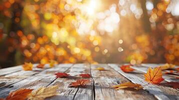 Rustic Wooden Table with Autumn Leaves and Blurred Background in Warm Sunlight photo