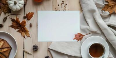 Autumn Mockup with Blank Card, Fall Leaves, Coffee, and Pumpkin photo
