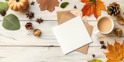 Autumn Greeting Card Mock-up with Fall Leaves, Coffee, and Pumpkin photo