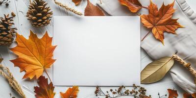Autumn Mockup with Fall Leaves, Pinecones, and Blank White Card photo