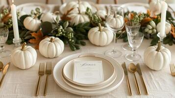 Elegant Thanksgiving Dinner Table Setting with White Pumpkins and Golden Cutlery photo