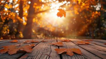 Autumn Leaves on Wooden Table Against Blurred Fall Background photo