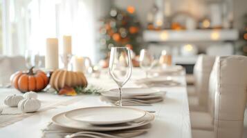 Elegant Fall Table Setting with Pumpkins and Candles for Thanksgiving Dinner photo