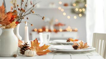 Elegant Autumn Table Setting with Fall Leaves and Warm Lighting Decoration photo