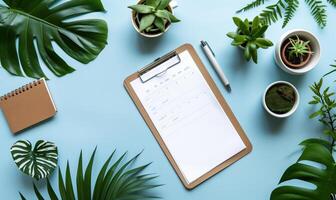 Minimalist Office Desk with Clipboard and Plants on Blue Background photo