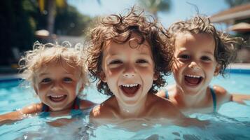 Three Happy Kids Playing in a Swimming Pool on a Sunny Day photo