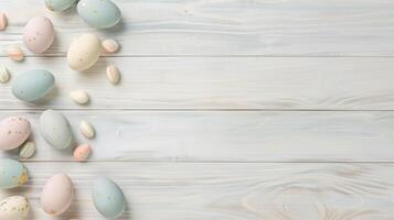 Happy Easter holiday background with colorful pastel eggs on white wooden table, top view, copy space photo