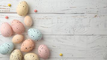 Happy Easter holiday background with colorful pastel eggs on white wooden table, top view, copy space photo