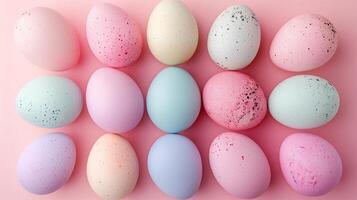 Copy space Happy Easter holiday background with colorful pastel eggs on pink paper, top view photo