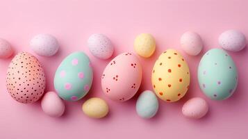 Copy space Happy Easter holiday background with colorful pastel eggs on pink paper, top view photo