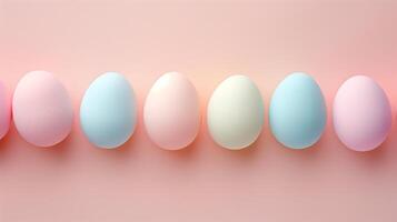 Happy Easter holiday background with colorful pastel eggs on pink paper, top view photo