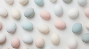 Happy Easter holiday background with colorful pastel eggs on white paper, top view photo