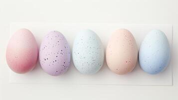 Happy Easter holiday background with colorful pastel eggs on white paper, top view photo