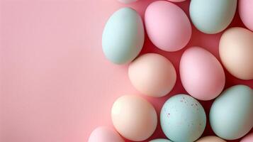 Copy space Happy Easter holiday background with colorful pastel eggs on pink paper, top view photo