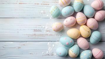 Happy Easter holiday background with colorful pastel eggs on white wooden table, top view, copy space photo