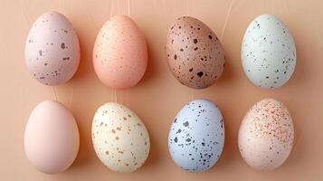 Happy Easter holiday background with colorful pastel eggs on beige paper, top view, copy space photo