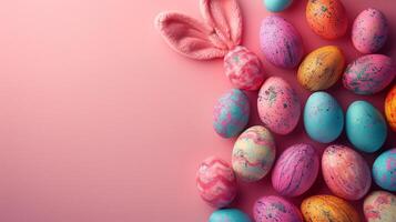 Easter flat lay composition. Bunny ears and Easter eggs on a pink background top view photo