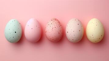 Copy space Happy Easter holiday background with colorful pastel eggs on pink paper, top view photo