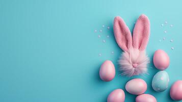 Easter flat lay composition. Bunny ears and Easter eggs on a blue background top view photo