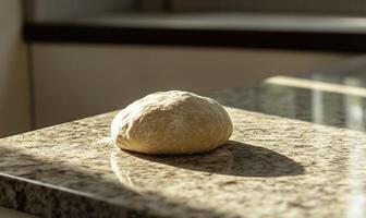 Smooth dough for bread on a granite countertop photo