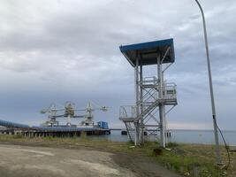 Industrial View of a Metal Structure and Crane in a Harbor photo