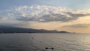 Seascape with Distant Mountains and Boats photo