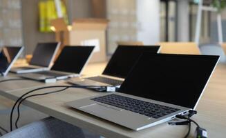 Laptops on a table in a co-working space photo
