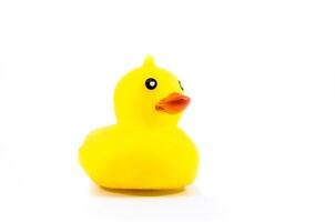 rubber yellow duck toy isolated on side view photo