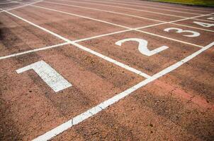 running track with close on numner one photo