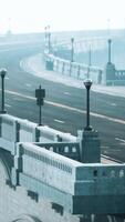 An empty illuminated asphalt road in a thick fog video
