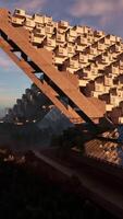 A towering skyscraper with a multitude of windows shining in the sunlight video