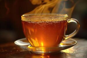 A Steaming Cup of Tea with Bubbles on a Wooden Surface photo