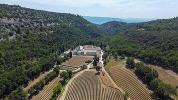 Cistercian Abbey of Senanque in Provence, a place of tranquility and prayer among mountains, trees and lavender fields. Ancient abbey founded in the 12th century by a monastic order. photo