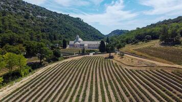 Cistercian Abbey of Senanque in Provence, a place of tranquility and prayer among mountains, trees and lavender fields. Ancient abbey founded in the 12th century by a monastic order. photo