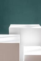 Three white boxes stacked on table, creating shelving like structure for product presentations. photo