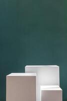 Three white rectangular boxes against a green wall. Product photography background photo