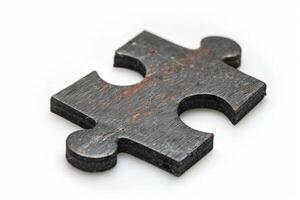 Vintage wooden puzzle on a white background photo