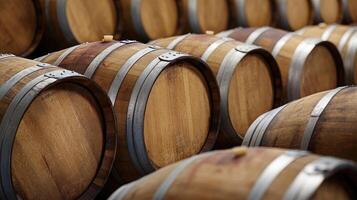 Wooden barrels stacked tightly in a rustic winery, showcasing craftsmanship and aged materials in late afternoon light photo