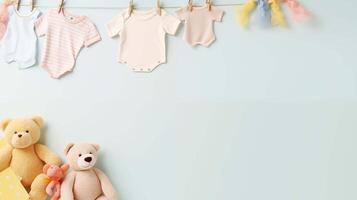 Pastel baby onesies and soft toys banner background copy space. Preparation for joyful arrival image backdrop empty. Parenting blog. Babyhood concept composition top view, copyspace photo