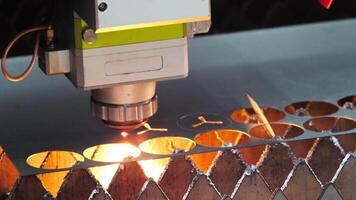 Detailed view of the functioning of a sophisticated metal laser machine, which precisely excises circular components from a sheet of metal. Close up. Slow motion video